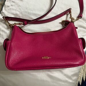 Coach handbag. Fuchsia pink. Used a few times. In very good condition. 9” wide